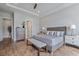 Comfortable main bedroom featuring hardwood floors, tray ceilings, and large windows for natural light at 357 Tupelo Lake Dr, Summerville, SC 29486