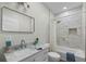 Bathroom with a marble countertop, white cabinets, and a tiled shower/tub combo with niche at 39 Briarcliff Dr, Charleston, SC 29407