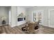 Comfortable seating area in living room with electric fireplace, leading to backyard at 39 Briarcliff Dr, Charleston, SC 29407