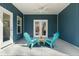 Cozy covered patio featuring blue siding, ceiling fan, and a seating area at 39 Briarcliff Dr, Charleston, SC 29407