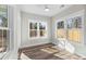 Bright sunroom featuring natural light from multiple windows, light-colored walls and ceilings, and wood-look floors at 39 Briarcliff Dr, Charleston, SC 29407