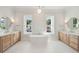 Bright bathroom featuring a soaking tub, double vanities, and large windows at 3902 Summerton St, Mount Pleasant, SC 29466