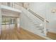 Two-story foyer with a staircase, hardwood floors, and a view of the living room at 3902 Summerton St, Mount Pleasant, SC 29466