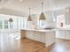 Spacious kitchen with a large island, pendant lighting, and hardwood flooring at 3902 Summerton St, Mount Pleasant, SC 29466