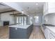 Spacious kitchen boasts an island, hardwood floors, white subway tile backsplash and stainless appliances at 3902 Summerton St, Mount Pleasant, SC 29466