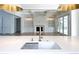 Open-concept kitchen with marble counters and backsplash, stainless steel appliances, and island sink at 3902 Summerton St, Mount Pleasant, SC 29466