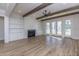 Light-filled living room features a fireplace, built-ins, hardwood floors and access to the outdoors at 3902 Summerton St, Mount Pleasant, SC 29466