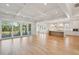 Open-concept living space with hardwood floors connecting the living room to the modern kitchen at 3902 Summerton St, Mount Pleasant, SC 29466