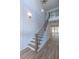 Staircase with hardwood floors, black iron railings and a two-story foyer at 3902 Summerton St, Mount Pleasant, SC 29466