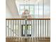 Bright staircase featuring woven pendant lighting and white banisters at 3902 Summerton St, Mount Pleasant, SC 29466