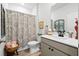 Bright bathroom features a decorative shower curtain, elegant vanity, and stylish fixtures at 400 Hampstead Ct, Summerville, SC 29486