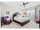 Comfortable bedroom with ceiling fan, armchair and tufted headboard at 400 Hampstead Ct, Summerville, SC 29486