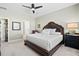 Cozy bedroom with a tufted headboard, soft carpet, and ample natural light from the windows at 400 Hampstead Ct, Summerville, SC 29486