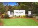 Elegant community entrance sign surrounded by lush landscaping and mature trees at 400 Hampstead Ct, Summerville, SC 29486