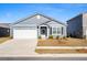 Inviting single-story home with a tidy lawn, attached garage, and a welcoming front door with wreath at 400 Hampstead Ct, Summerville, SC 29486