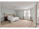 Spacious bedroom with a large window, neutral walls, and a ceiling fan at 4336 Purdue Dr, North Charleston, SC 29418