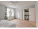 Inviting bedroom featuring large window, double closets, built-in desk, and wood floors at 4336 Purdue Dr, North Charleston, SC 29418