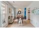 Dining area with table, bar cart, surfboard and access to kitchen at 4336 Purdue Dr, North Charleston, SC 29418