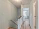 Upstairs hallway with natural light and wood flooring, leading to the bedrooms at 4336 Purdue Dr, North Charleston, SC 29418