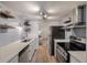 Modern kitchen featuring stainless steel appliances, floating shelves, and quartz countertops at 4336 Purdue Dr, North Charleston, SC 29418