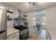 Well-lit kitchen with stainless steel appliances and an open view to the dining area at 4336 Purdue Dr, North Charleston, SC 29418