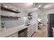 Stylish kitchen featuring floating shelves, updated countertops, stainless steel appliances, and ample storage at 4336 Purdue Dr, North Charleston, SC 29418