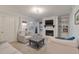 Bright living room with fireplace, TV, and access to the outdoors at 4336 Purdue Dr, North Charleston, SC 29418