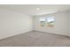 Bedroom features neutral carpet, white walls, two windows, and plenty of natural light at 4368 Ocean Farm Dr, Summerville, SC 29485