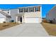 Daytime view of a two-story house with a two-car garage and a well-maintained front yard at 4368 Ocean Farm Dr, Summerville, SC 29485