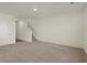 Spacious living room featuring neutral carpet, white walls, and a staircase at 4368 Ocean Farm Dr, Summerville, SC 29485