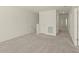 Upstairs loft area with neutral carpet, white walls, and access to bedrooms and closets at 4368 Ocean Farm Dr, Summerville, SC 29485