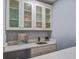 Stylish wet bar featuring elegant cabinetry, quartz countertops, and a modern sink, perfect for entertaining guests at 4618 Moss Ct, Charleston, SC 29420