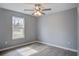 This bedroom features wood flooring, neutral walls and ceiling fan with light at 4618 Moss Ct, Charleston, SC 29420