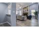 Cozy living room with a stone fireplace, ceiling fan, and stylish furnishings, perfect for relaxing and entertaining at 4618 Moss Ct, Charleston, SC 29420