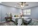 Bright main bedroom featuring a ceiling fan, a window, and stylish decor at 4618 Moss Ct, Charleston, SC 29420