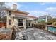 Back deck leading to a pool featuring wood railings and a seating area at 4634 O'Hear Ave, North Charleston, SC 29405