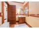 Classic bathroom featuring wooden vanity, tile floor, and warm neutral color scheme at 4634 O'Hear Ave, North Charleston, SC 29405