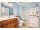 Full bathroom with sliding glass shower doors, vanity, and toilet at 4634 O'Hear Ave, North Charleston, SC 29405