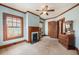 Comfortable bedroom featuring warm trim, inviting fireplace, and open doorway to another room at 4634 O'Hear Ave, North Charleston, SC 29405