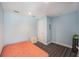 Bedroom with a white nightstand, a window, and a brightly colored striped rug at 4634 O'Hear Ave, North Charleston, SC 29405