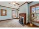 Bright bedroom with a fireplace, large windows, and neutral tones creating a serene space at 4634 O'Hear Ave, North Charleston, SC 29405