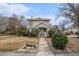 Charming two-story home featuring well-maintained landscaping and a welcoming front porch with traditional architectural details at 4634 O'Hear Ave, North Charleston, SC 29405