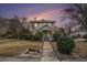 Charming two-story home featuring well-maintained landscaping and a welcoming front porch with traditional architectural details at 4634 O'Hear Ave, North Charleston, SC 29405