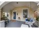 Inviting front porch featuring a swing, comfortable seating, and a glimpse of the home's welcoming entrance at 4634 O'Hear Ave, North Charleston, SC 29405