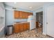 Kitchenette area adjacent to a full bathroom with a sink, cabinets, and stainless refrigerator at 4634 O'Hear Ave, North Charleston, SC 29405