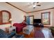 Inviting living room featuring hardwood floors, a cozy sofa, and natural light streaming in through the windows at 4634 O'Hear Ave, North Charleston, SC 29405