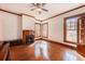 Bright living room with hardwood floors, fireplace, and original wood trim at 4634 O'Hear Ave, North Charleston, SC 29405