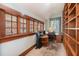 Sunlit office boasting built-in shelving, a large window, and functional desk setup at 4634 O'Hear Ave, North Charleston, SC 29405
