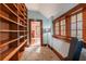 Bright office featuring built-in bookshelves, natural light, and view to living area with fireplace at 4634 O'Hear Ave, North Charleston, SC 29405