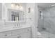 Bright bathroom featuring white vanity, modern fixtures, and glass shower with marble-style tile at 471 Springfield Rd, Mount Pleasant, SC 29464